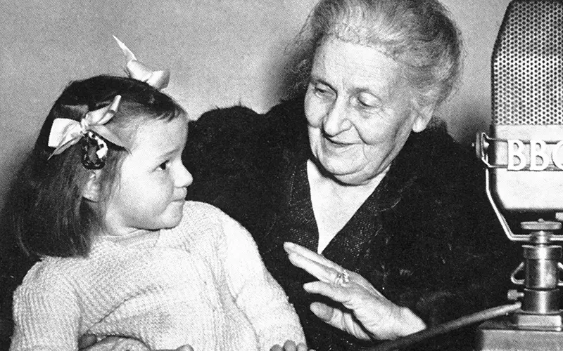 elderly woman holding a smiling child