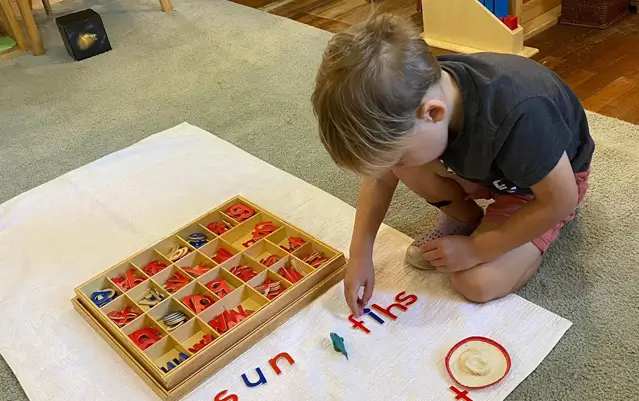 young child engaged in a word puzzle activity