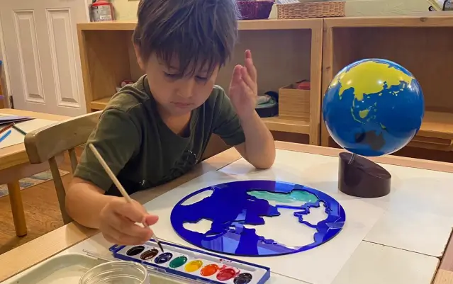 child engaged in a class room activity