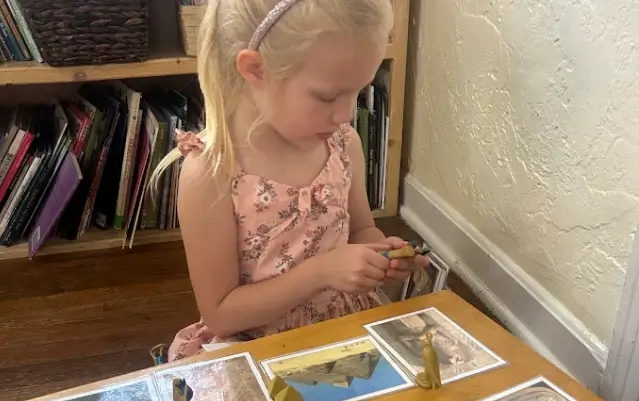 child engaged in a class room activity