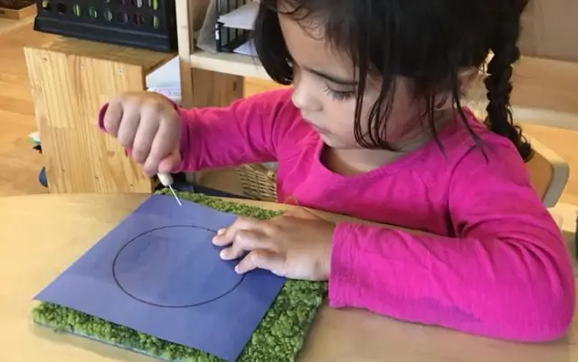 child engaged in a class room activity